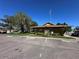 Community clubhouse with well-manicured landscaping, providing a central meeting space for residents at 1640 Juno Trl # 205B, Astor, FL 32102