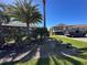 Well-maintained community buildings surrounded by lush landscaping and green lawns on a bright, sunny day at 1640 Juno Trl # 205B, Astor, FL 32102