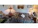 Cozy living room with comfortable seating and a pass-through to the kitchen, perfect for entertaining at 1640 Juno Trl # 205B, Astor, FL 32102