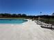 Outdoor community pool featuring a deck with lounge chairs, perfect for relaxation and recreation at 1640 Juno Trl # 205B, Astor, FL 32102