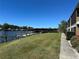 Lush lawn extends to the waterfront with boat dock and boat house at 1640 Juno Trl # 205B, Astor, FL 32102