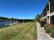 Grassy area leading to waterfront dock and boat house at 1640 Juno Trl # 205B, Astor, FL 32102