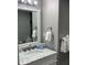 Bright bathroom with marble countertop vanity and stylish fixtures at 1909 S Atlantic Ave # 703, Daytona Beach, FL 32118
