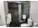 Modern bathroom featuring a glass-enclosed shower with stone tile surround at 1909 S Atlantic Ave # 703, Daytona Beach, FL 32118