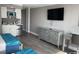 Bedroom featuring two beds, a small refrigerator, cabinets, desk, and a television at 1909 S Atlantic Ave # 703, Daytona Beach, FL 32118
