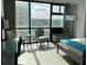 Bright bedroom with large windows and city views at 1909 S Atlantic Ave # 703, Daytona Beach, FL 32118