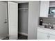 Clean kitchenette with cabinets, sink, and closet space at 1909 S Atlantic Ave # 703, Daytona Beach, FL 32118