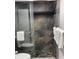 Clean shower with stone tile and a sliding glass door at 1909 S Atlantic Ave # 703, Daytona Beach, FL 32118