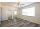 Comfortable bedroom offers new floors, a ceiling fan, and mirrored closet doors at 1920 E Edgewood Dr # D1, Lakeland, FL 33803