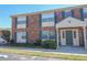 Charming two-story condo with brick facade, inviting entrance, and well-maintained landscaping at 1920 E Edgewood Dr # D1, Lakeland, FL 33803