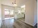 Open kitchen and dining area leads to a screened-in patio, perfect for relaxing at 1920 E Edgewood Dr # D1, Lakeland, FL 33803