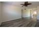 Bright living room featuring modern flooring and a ceiling fan for added comfort at 1920 E Edgewood Dr # D1, Lakeland, FL 33803