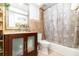 Bathroom featuring a granite countertop and a shower and bathtub combo with a curtain at 1928 South Blvd, Maitland, FL 32751