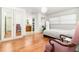 Bright bedroom featuring an ensuite bathroom, ample natural light, and hardwood flooring at 1928 South Blvd, Maitland, FL 32751