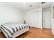 Bright bedroom features wood floors, ceiling fan, and double door closet at 1928 South Blvd, Maitland, FL 32751