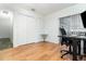 This bedroom features wood floors, a double door closet, and a white table at 1928 South Blvd, Maitland, FL 32751