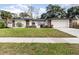 Charming single Gathering home with a well-manicured front yard and stone accents at 1928 South Blvd, Maitland, FL 32751