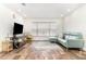 Bright living room with sleek floors, modern furniture, and a large window at 1928 South Blvd, Maitland, FL 32751