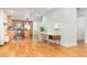 Open floor plan with sleek floors connecting a dining area to the kitchen at 1928 South Blvd, Maitland, FL 32751