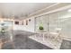Covered patio with tile floor, table and chairs, and sliding glass doors at 1928 South Blvd, Maitland, FL 32751