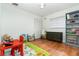 Bright and airy playroom with hardwood floors, storage shelves, and a closet at 1928 South Blvd, Maitland, FL 32751