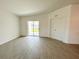 Bedroom featuring a sliding glass door to the backyard and a closet with panel doors at 2117 Lincoln Ln, Bartow, FL 33830