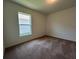 Cozy bedroom with carpet and bright window overlooking the exterior at 2117 Lincoln Ln, Bartow, FL 33830