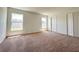 Bright bedroom with dual windows and a double-door closet, offering ample space at 2117 Lincoln Ln, Bartow, FL 33830