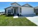 Charming single-Gathering home featuring a two-car garage, stone accents, and a well-maintained lawn at 2117 Lincoln Ln, Bartow, FL 33830