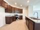 Well-lit kitchen features granite counters, a stainless steel oven, and ample cabinet space at 2117 Lincoln Ln, Bartow, FL 33830