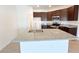Modern kitchen boasting granite countertops, stainless steel appliances, and dark wood cabinetry at 2117 Lincoln Ln, Bartow, FL 33830