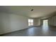 Spacious living room with tile floors and ample natural light from large windows and sliding glass doors at 2117 Lincoln Ln, Bartow, FL 33830