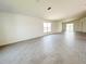 Expansive living room featuring stylish tile flooring and abundant natural light through large windows at 2117 Lincoln Ln, Bartow, FL 33830
