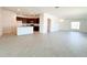 Open-concept layout with tile flooring flows into a modern kitchen with an island at 2117 Lincoln Ln, Bartow, FL 33830