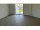 Bright room with sliding glass doors, a door to a closet, and modern tile flooring at 2117 Lincoln Ln, Bartow, FL 33830