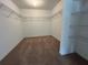 Spacious walk-in closet featuring carpet and wire shelving for ample storage at 2117 Lincoln Ln, Bartow, FL 33830