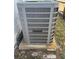 Outdoor AC unit on a concrete slab with mature landscaping at 2336 Nansen Ave, Orlando, FL 32817