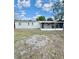 Backyard with a partially enclosed patio at 2336 Nansen Ave, Orlando, FL 32817