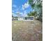 Backyard with a partially enclosed patio and some young trees at 2336 Nansen Ave, Orlando, FL 32817