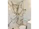 Walk-in shower features rainfall shower head and mosaic tile floor at 2336 Nansen Ave, Orlando, FL 32817