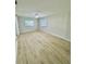 Cozy bedroom showcasing contemporary floors, a ceiling fan, and abundant natural light at 2336 Nansen Ave, Orlando, FL 32817