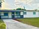 Charming single-story home with a well-maintained lawn and long driveway at 2336 Nansen Ave, Orlando, FL 32817