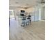 Open-concept kitchen with island and white cabinets at 2336 Nansen Ave, Orlando, FL 32817