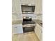 Bright kitchen with white cabinets, granite countertops and stainless steel appliances at 2336 Nansen Ave, Orlando, FL 32817