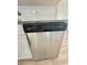 Stainless steel dishwasher, granite countertops and modern white cabinets in updated kitchen at 2336 Nansen Ave, Orlando, FL 32817