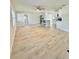 Bright, open-concept living space featuring modern flooring and neutral walls at 2336 Nansen Ave, Orlando, FL 32817