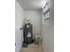 A water heater in the utility room, offering ample hot water and efficient design at 2336 Nansen Ave, Orlando, FL 32817