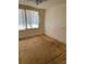 Bedroom with plywood flooring and a window at 24047 Ermine Rd, Astor, FL 32102