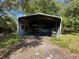 Carport providing sheltered parking at 24047 Ermine Rd, Astor, FL 32102