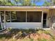 Enclosed porch area with access to backyard at 24047 Ermine Rd, Astor, FL 32102